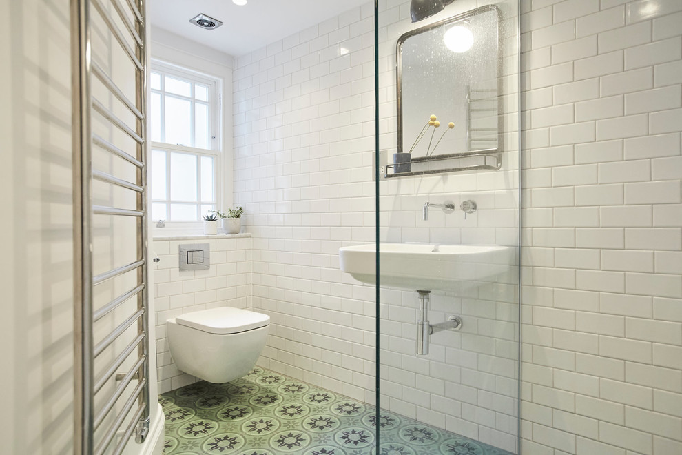 This is an example of a medium sized bathroom in Sussex with a wall mounted toilet, white tiles, metro tiles, a wall-mounted sink, marble worktops, an open shower and white worktops.