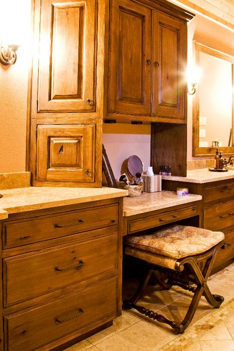 Photo of an expansive rustic ensuite bathroom in Charlotte with a submerged sink, raised-panel cabinets, medium wood cabinets, granite worktops, an alcove bath, an alcove shower, a two-piece toilet, beige tiles, ceramic tiles, beige walls and ceramic flooring.