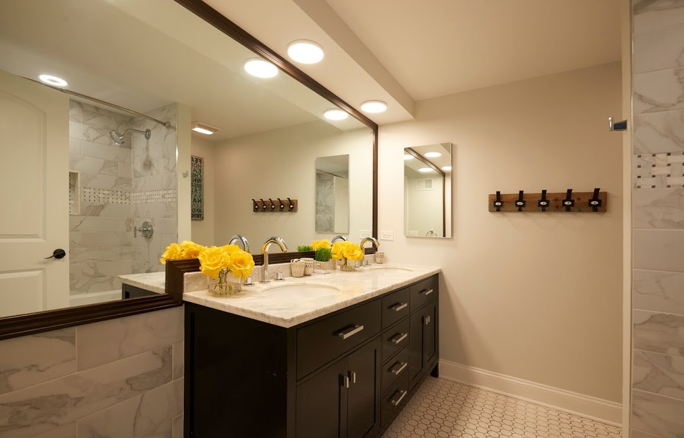 Example of a small transitional 3/4 gray tile and marble tile mosaic tile floor and white floor bathroom design in Chicago with shaker cabinets, dark wood cabinets, a one-piece toilet, beige walls, an undermount sink, marble countertops and white countertops