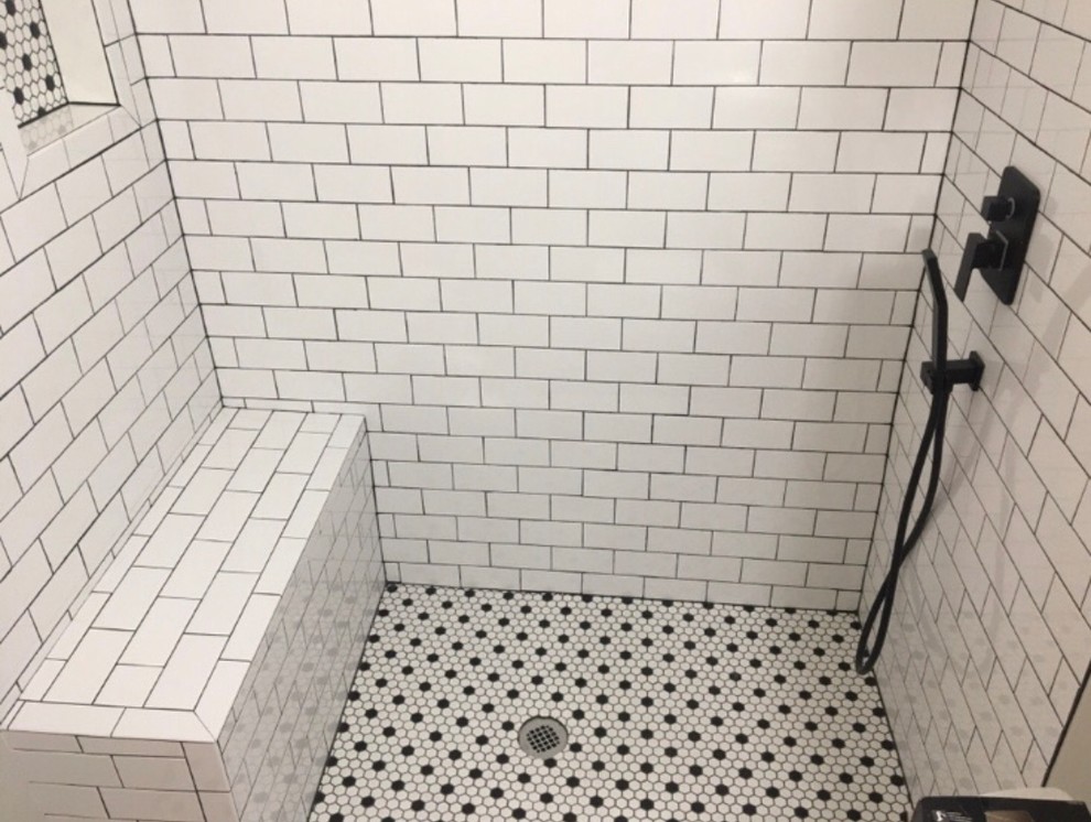 Example of a small minimalist master white tile and subway tile mosaic tile floor and black floor bathroom design in DC Metro with dark wood cabinets, a one-piece toilet, gray walls, a drop-in sink, solid surface countertops and white countertops