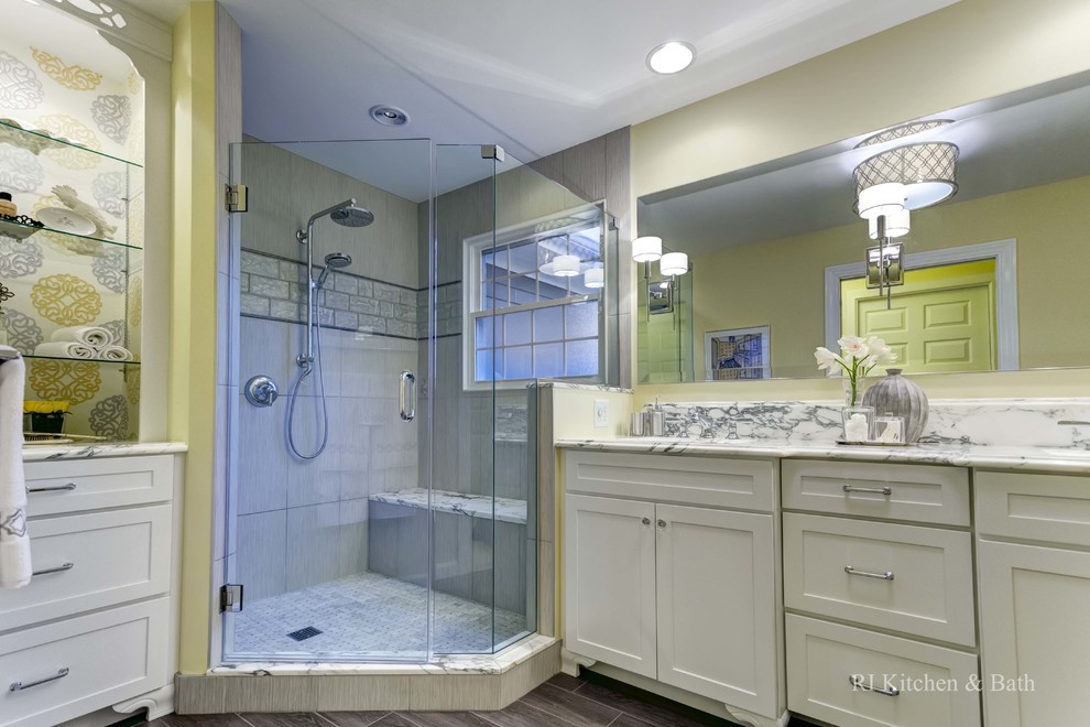 Design ideas for a large classic ensuite bathroom in Providence with a submerged sink, shaker cabinets, white cabinets, marble worktops, a corner shower, a two-piece toilet, grey tiles, glass tiles, beige walls and porcelain flooring.