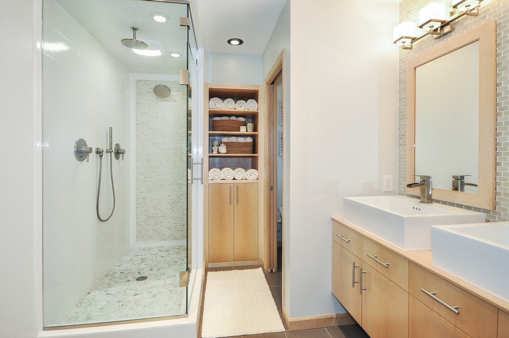 Example of a small trendy master gray tile ceramic tile double shower design in Minneapolis with a vessel sink, flat-panel cabinets, light wood cabinets, wood countertops, a bidet and gray walls