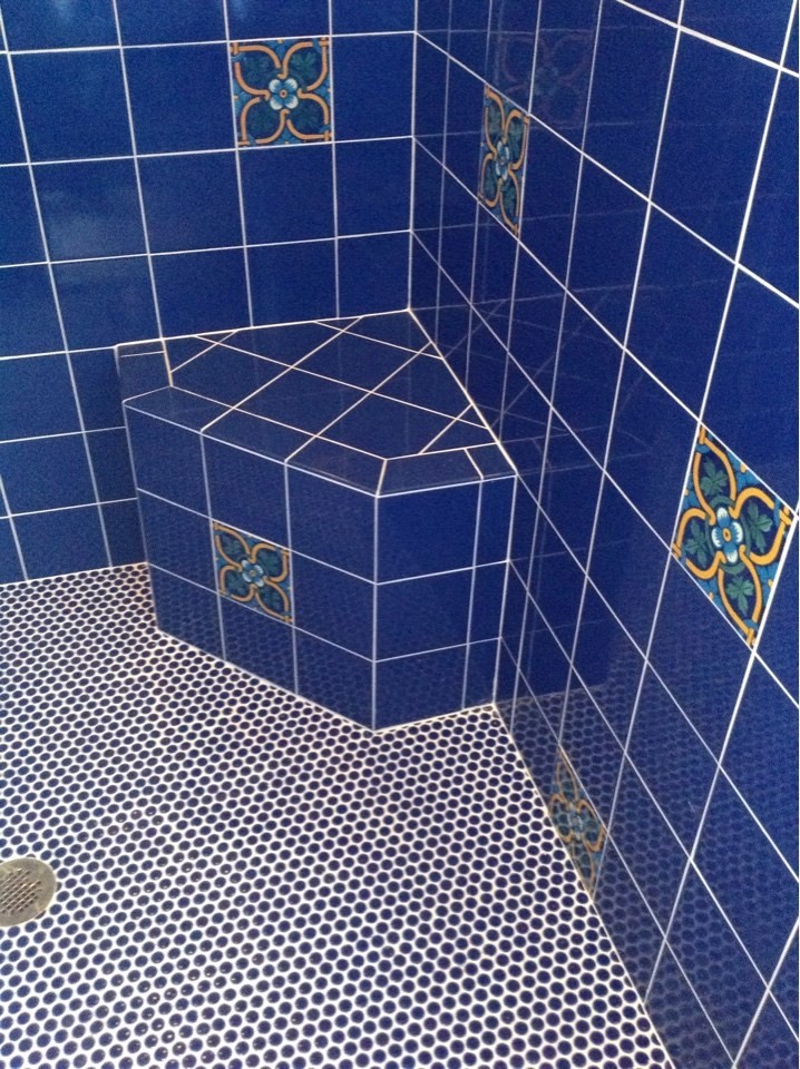 Example of a tuscan master blue tile and ceramic tile ceramic tile doorless shower design in Phoenix with blue walls