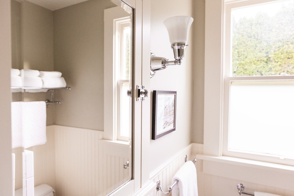Photo of a small traditional bathroom in Portland with beige walls and dark hardwood flooring.