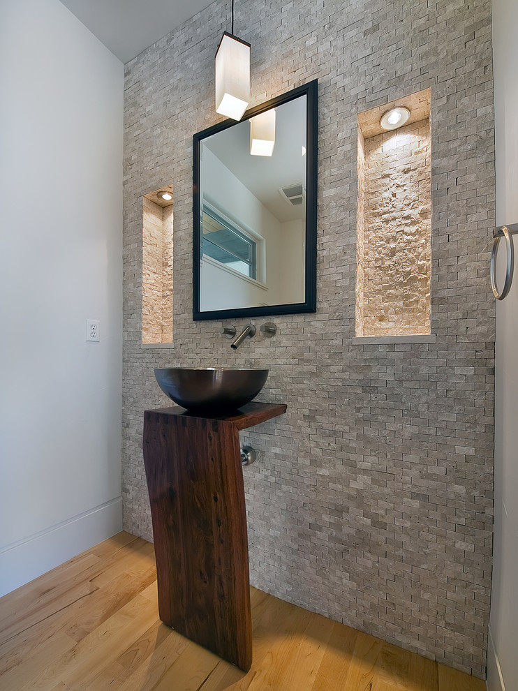 Design ideas for a contemporary bathroom in Denver with a vessel sink, wooden worktops, grey tiles and stone tiles.