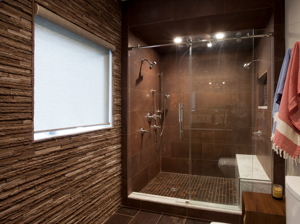 Example of a minimalist master brown tile alcove shower design in New York with a vessel sink, furniture-like cabinets and brown walls
