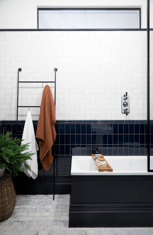 Monochrome Drama: A Tub Tale with Black and White Wall Tiles for Scandinavian Bathroom Ideas