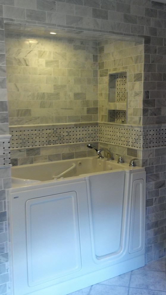 Example of a classic white tile bathroom design in Charlotte