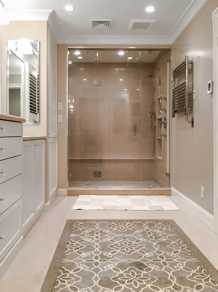 Example of a mid-sized trendy 3/4 brown tile and porcelain tile gray floor alcove shower design in New York with recessed-panel cabinets, gray cabinets, beige walls, a hinged shower door and beige countertops