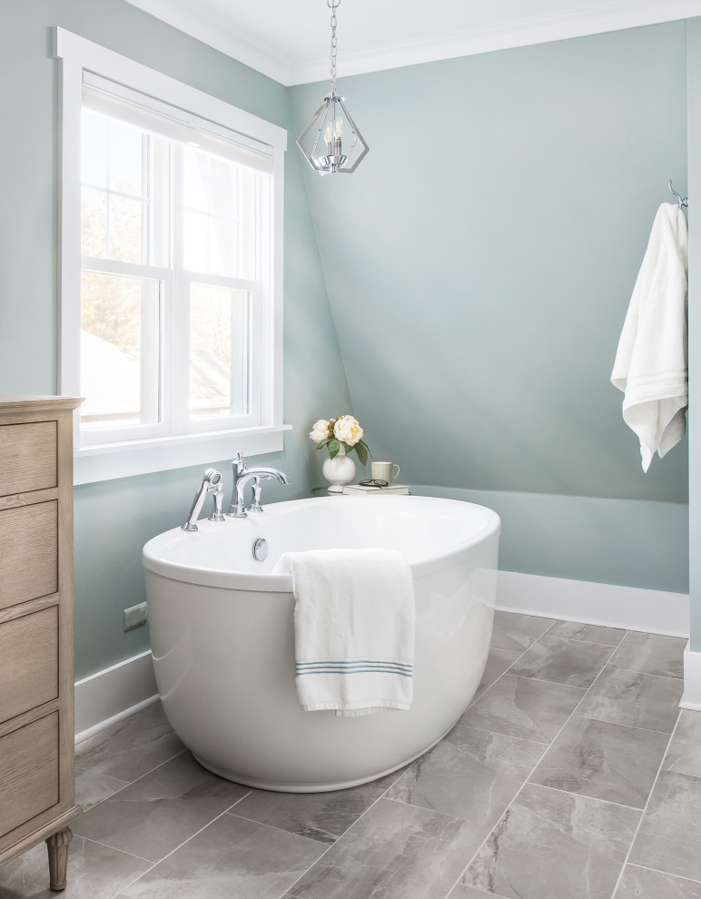 Inspiration for a mid-sized transitional master porcelain tile and beige floor bathroom remodel with recessed-panel cabinets, beige cabinets, a two-piece toilet, green walls, an undermount sink, quartz countertops, a hinged shower door and white countertops