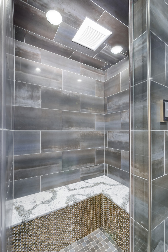 Inspiration for a huge transitional master multicolored tile and porcelain tile porcelain tile and gray floor bathroom remodel in Cleveland with raised-panel cabinets, gray cabinets, a two-piece toilet, beige walls, a vessel sink, quartz countertops, a hinged shower door and gray countertops
