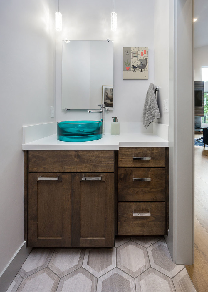 Example of a large trendy gray tile and porcelain tile porcelain tile bathroom design in Other with shaker cabinets, dark wood cabinets, white walls, a vessel sink and quartz countertops