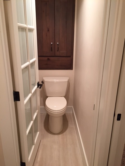 Inspiration for a small traditional cloakroom in Denver with flat-panel cabinets, dark wood cabinets, a one-piece toilet, grey tiles, ceramic tiles, white walls, ceramic flooring and granite worktops.