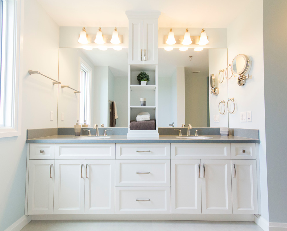 Inspiration for a traditional bathroom in Edmonton with recessed-panel cabinets, white cabinets, a corner shower, blue tiles, blue walls, white floors, a hinged door, blue worktops, double sinks and a built in vanity unit.