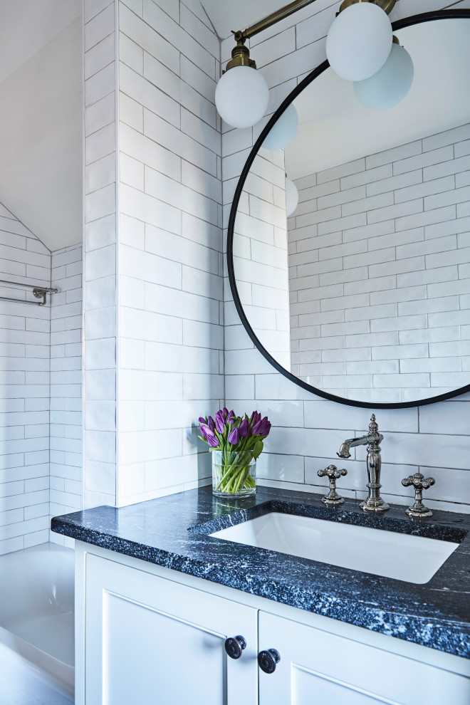 Inspiration for a medium sized traditional bathroom in Atlanta with shaker cabinets, white cabinets, an alcove bath, a shower/bath combination, white tiles, ceramic tiles, white walls, a submerged sink, a shower curtain, black worktops, an enclosed toilet, a single sink and a built in vanity unit.