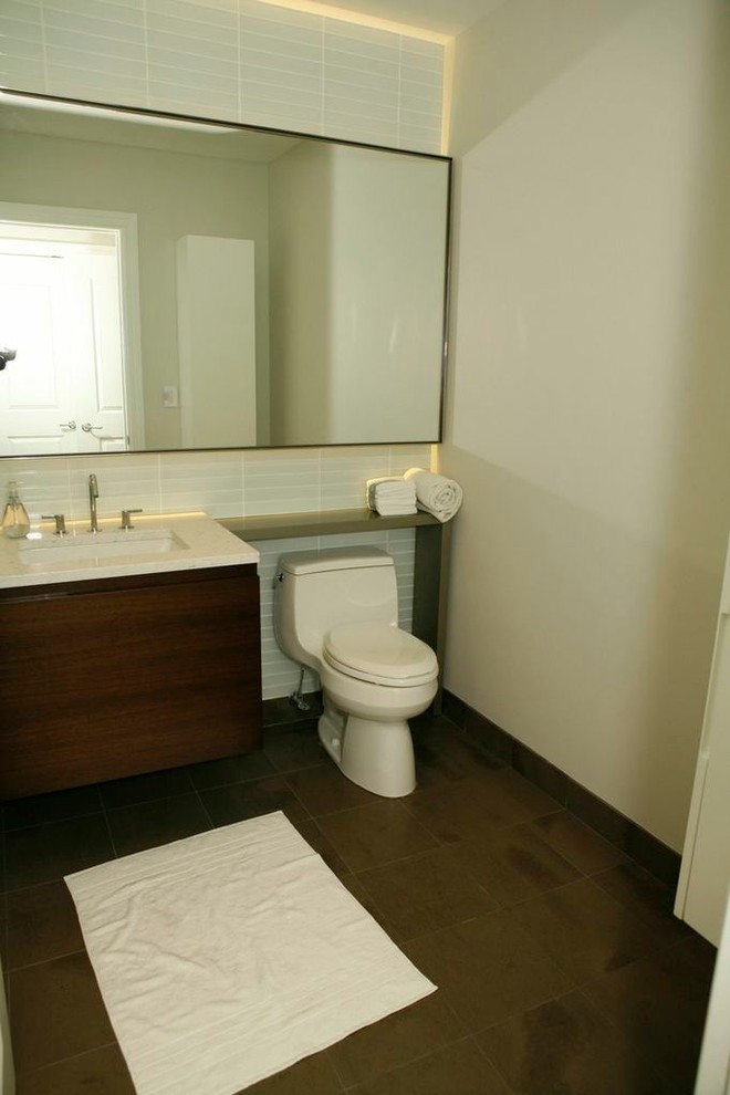 Mid-sized trendy master brown tile ceramic tile bathroom photo in Chicago with an undermount sink, flat-panel cabinets, dark wood cabinets and white walls