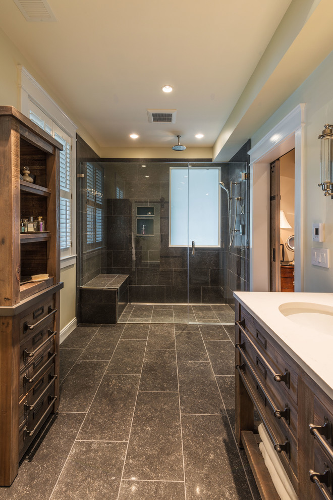 Photo of a large rural ensuite bathroom in DC Metro with recessed-panel cabinets, distressed cabinets, a walk-in shower, brown tiles, ceramic tiles, beige walls, ceramic flooring, a submerged sink, granite worktops and a hinged door.