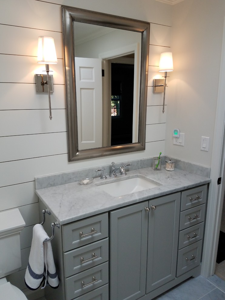 Inspiration for a medium sized traditional shower room bathroom in Bridgeport with recessed-panel cabinets, grey cabinets, an alcove shower, a one-piece toilet, white walls, marble flooring, a submerged sink, marble worktops, grey floors, a hinged door, grey tiles and metro tiles.