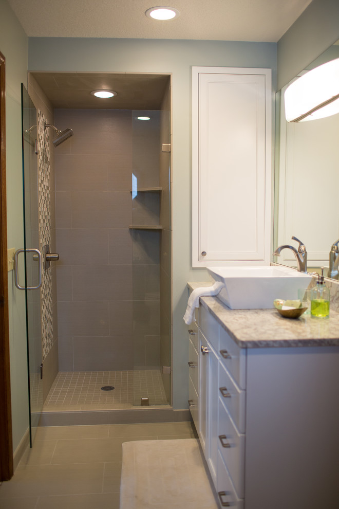 Example of a mid-sized classic master alcove shower design in Other with recessed-panel cabinets, white cabinets, green walls, a vessel sink, granite countertops and a hinged shower door