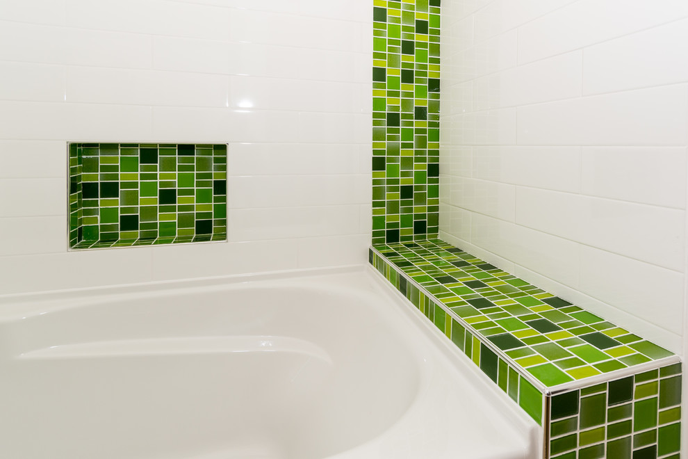 Design ideas for a small contemporary ensuite bathroom in Vancouver with an integrated sink, flat-panel cabinets, white cabinets, tiled worktops, a built-in bath, a shower/bath combination, a two-piece toilet, green tiles, glass sheet walls, white walls and lino flooring.