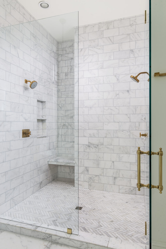 Inspiration for a mid-sized transitional master white tile and marble tile porcelain tile and white floor bathroom remodel in Nashville with shaker cabinets, white cabinets, white walls, an undermount sink, marble countertops, a hinged shower door and white countertops