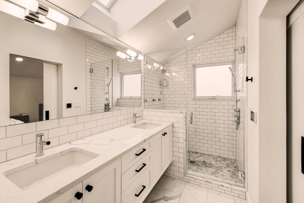 Photo of a medium sized classic ensuite bathroom in Seattle with shaker cabinets, white cabinets, white tiles, ceramic tiles, white walls, ceramic flooring, a submerged sink, engineered stone worktops, white floors, a hinged door, white worktops and an alcove shower.
