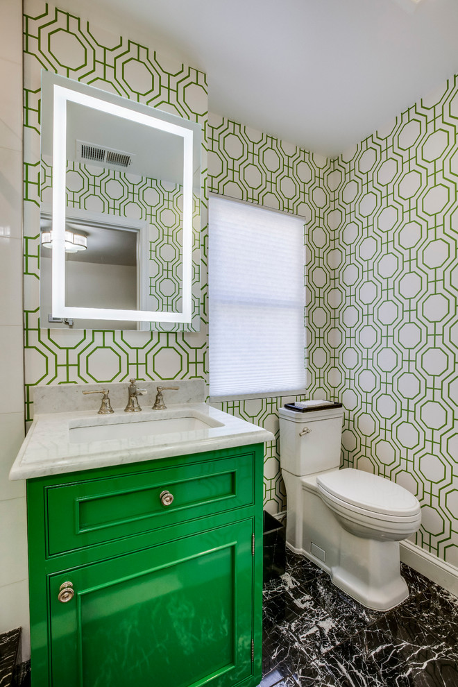 Photo of a small classic shower room bathroom in DC Metro with beaded cabinets, green cabinets, a corner shower, a one-piece toilet, white tiles, marble tiles, marble flooring, a submerged sink, marble worktops, black floors, a hinged door and white worktops.