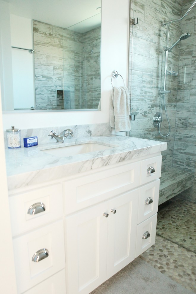 Inspiration for a contemporary gray tile and ceramic tile pebble tile floor walk-in shower remodel in Los Angeles with an undermount sink, shaker cabinets, white cabinets, marble countertops and white walls