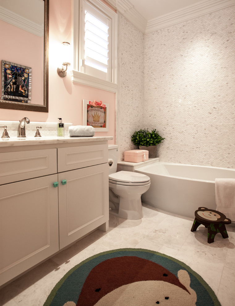 Inspiration for a mid-sized transitional white tile marble floor bathroom remodel in Dallas with an undermount sink, recessed-panel cabinets, white cabinets, marble countertops, a two-piece toilet and pink walls