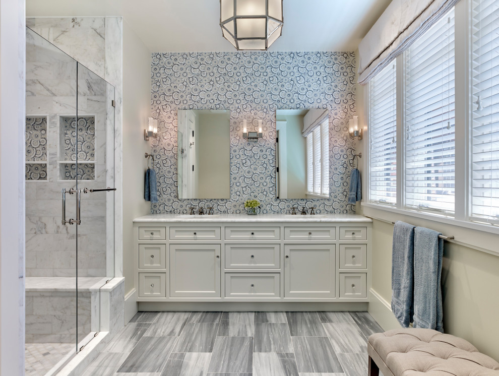 Photo of a traditional ensuite bathroom in Philadelphia with shaker cabinets, white cabinets, an alcove shower, blue tiles, mosaic tiles, white walls, marble flooring, an integrated sink, marble worktops, a hinged door and white worktops.