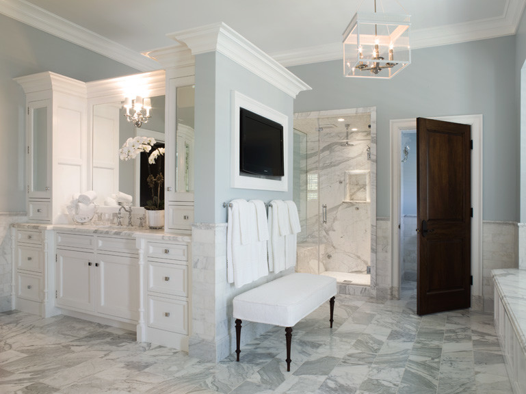 Inspiration for a timeless white tile corner shower remodel in Los Angeles with an undermount sink, white cabinets, marble countertops, an undermount tub, a two-piece toilet and recessed-panel cabinets