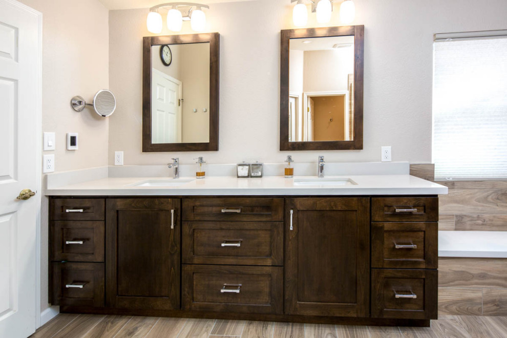 Photo of a medium sized rustic ensuite bathroom in Phoenix with flat-panel cabinets, brown cabinets, a built-in shower, a two-piece toilet, brown tiles, porcelain tiles, brown walls, porcelain flooring, a submerged sink, engineered stone worktops, brown floors, an open shower, white worktops, a wall niche, double sinks and a built in vanity unit.