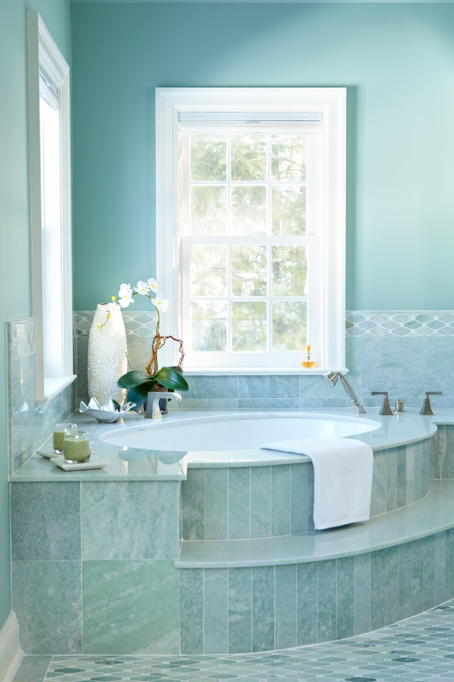 Design ideas for a traditional ensuite bathroom in Boston with green tiles, blue tiles, mosaic tile flooring, blue walls and a submerged bath.