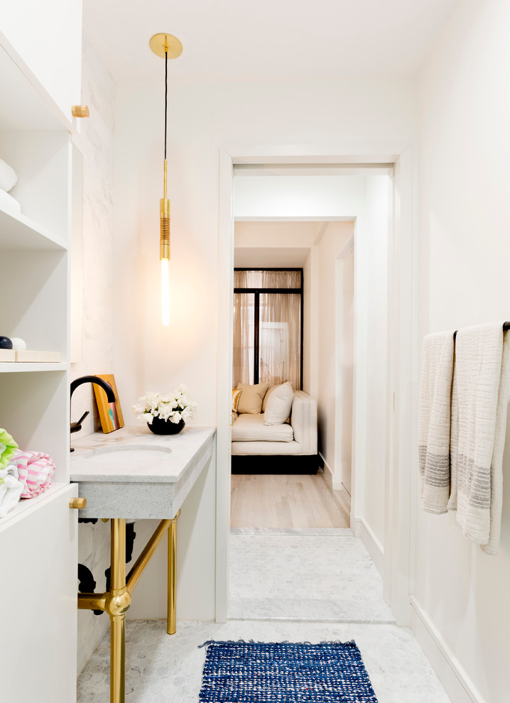 This is an example of a medium sized traditional shower room bathroom in New York with open cabinets, white cabinets, an alcove shower, white tiles, metro tiles, white walls, mosaic tile flooring, a submerged sink, a one-piece toilet and marble worktops.