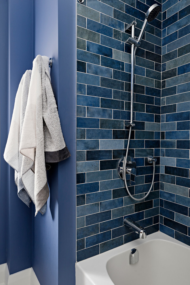 Example of a small transitional kids' blue tile and subway tile ceramic tile and gray floor bathroom design in Toronto with flat-panel cabinets, dark wood cabinets, a two-piece toilet, blue walls, an integrated sink, solid surface countertops and white countertops