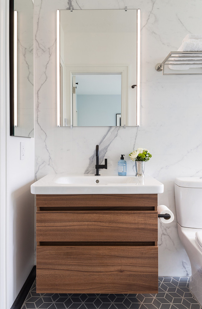 Bathroom - mid-sized modern master white tile and porcelain tile ceramic tile and gray floor bathroom idea in New York with flat-panel cabinets, medium tone wood cabinets, a one-piece toilet and an integrated sink