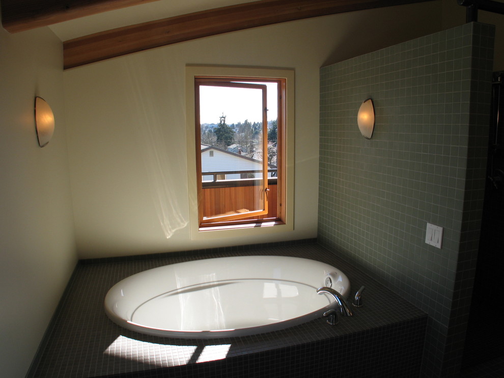 Example of a mid-sized trendy master gray tile and porcelain tile alcove bathtub design in Seattle with white walls