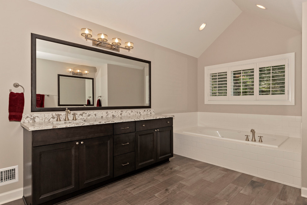 Bathroom - large transitional master white tile and ceramic tile ceramic tile and gray floor bathroom idea in Chicago with shaker cabinets, dark wood cabinets, a two-piece toilet, gray walls, an undermount sink, quartz countertops, a hinged shower door and white countertops