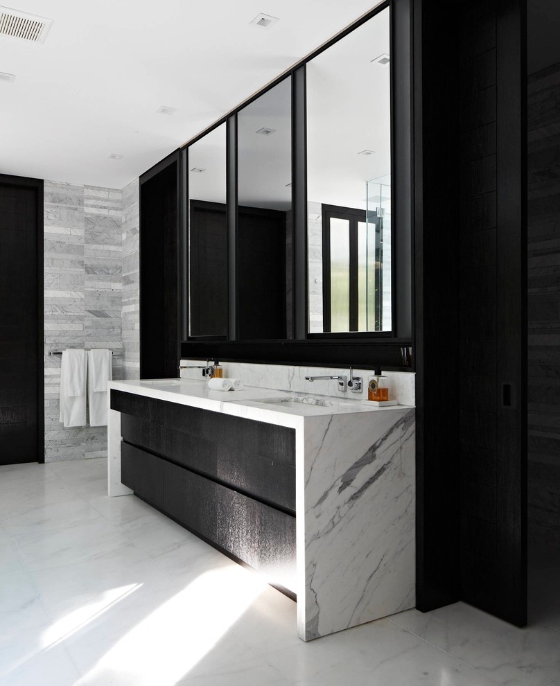 Bathroom - large contemporary master white tile and stone tile linoleum floor bathroom idea in New York with an undermount sink, flat-panel cabinets, black cabinets, gray walls and marble countertops
