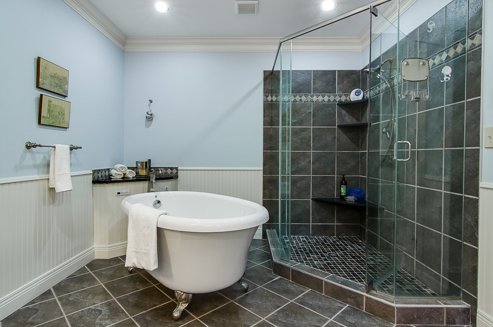 Large transitional master gray tile and stone tile slate floor and black floor bathroom photo in Louisville with raised-panel cabinets, white cabinets, a one-piece toilet, gray walls, a vessel sink, granite countertops and a hinged shower door