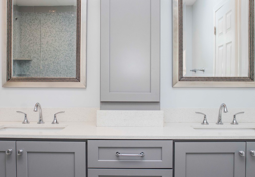 Large minimalist master gray tile and ceramic tile ceramic tile and beige floor bathroom photo in Providence with recessed-panel cabinets, gray cabinets, a two-piece toilet, gray walls, an undermount sink, quartzite countertops and a hinged shower door