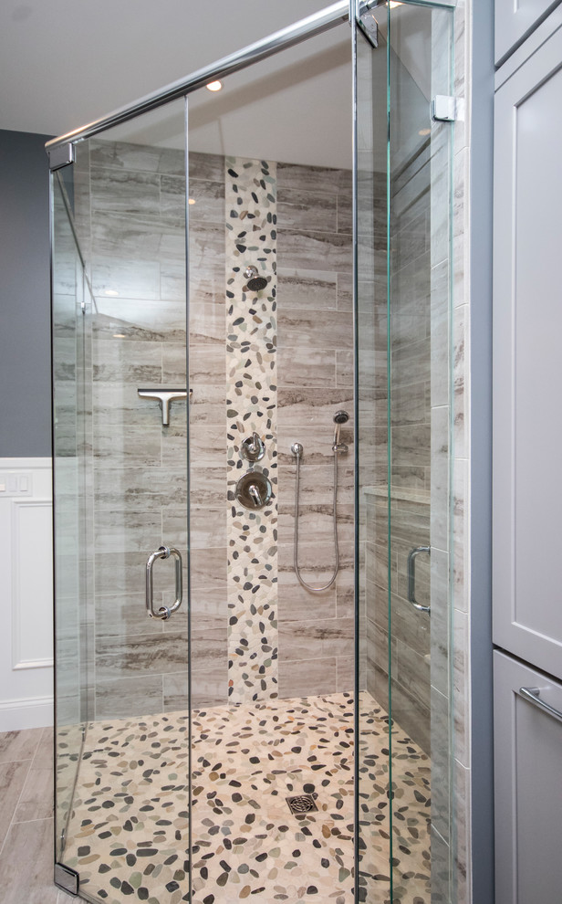 Corner shower - huge modern master multicolored tile and porcelain tile porcelain tile and beige floor corner shower idea in Providence with recessed-panel cabinets, gray cabinets, a two-piece toilet, gray walls, an undermount sink, quartzite countertops and a hinged shower door