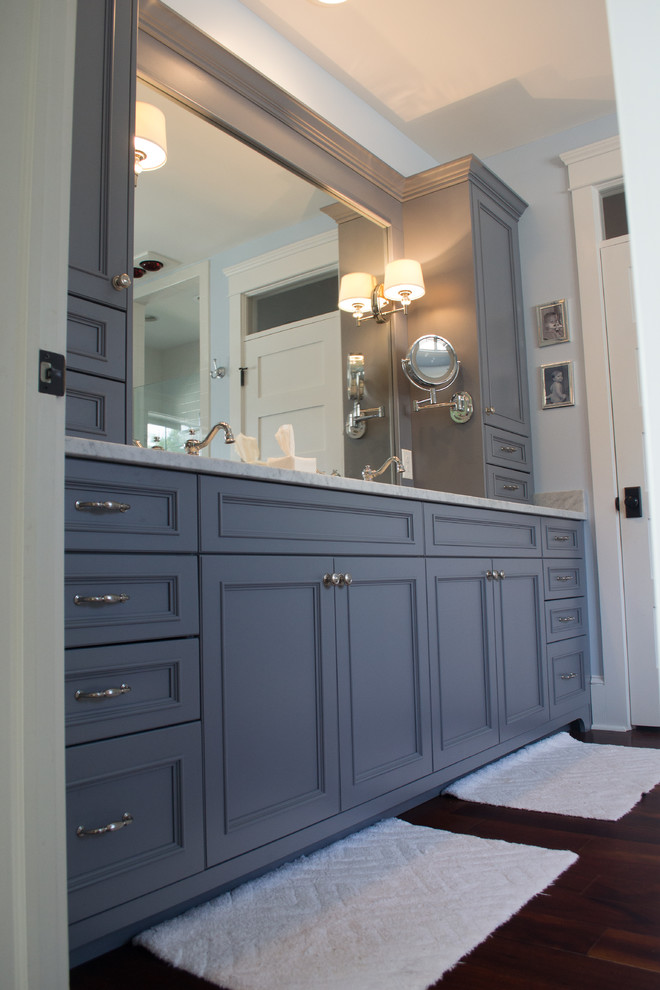 Example of a transitional master bathroom design in Wilmington with gray cabinets