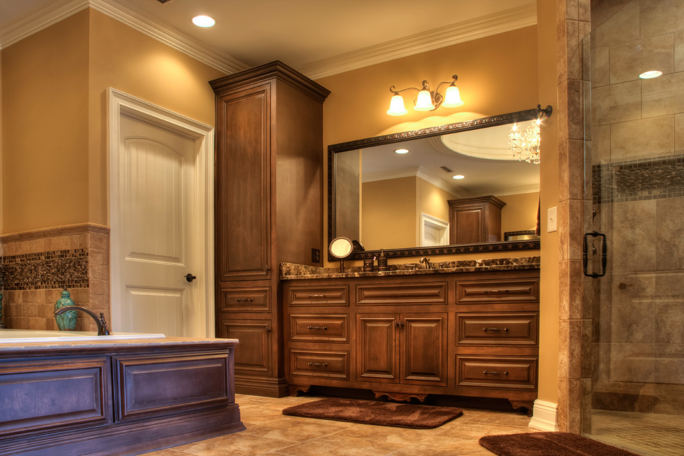 Example of an arts and crafts master brown tile and mosaic tile porcelain tile corner shower design in Other with raised-panel cabinets, dark wood cabinets, marble countertops, a two-piece toilet, an undermount sink and brown walls