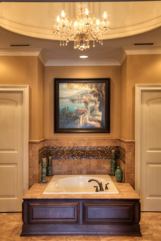 Example of a large classic master brown tile and mosaic tile porcelain tile corner shower design in Other with raised-panel cabinets, dark wood cabinets, marble countertops, a hot tub, a two-piece toilet, an undermount sink and brown walls