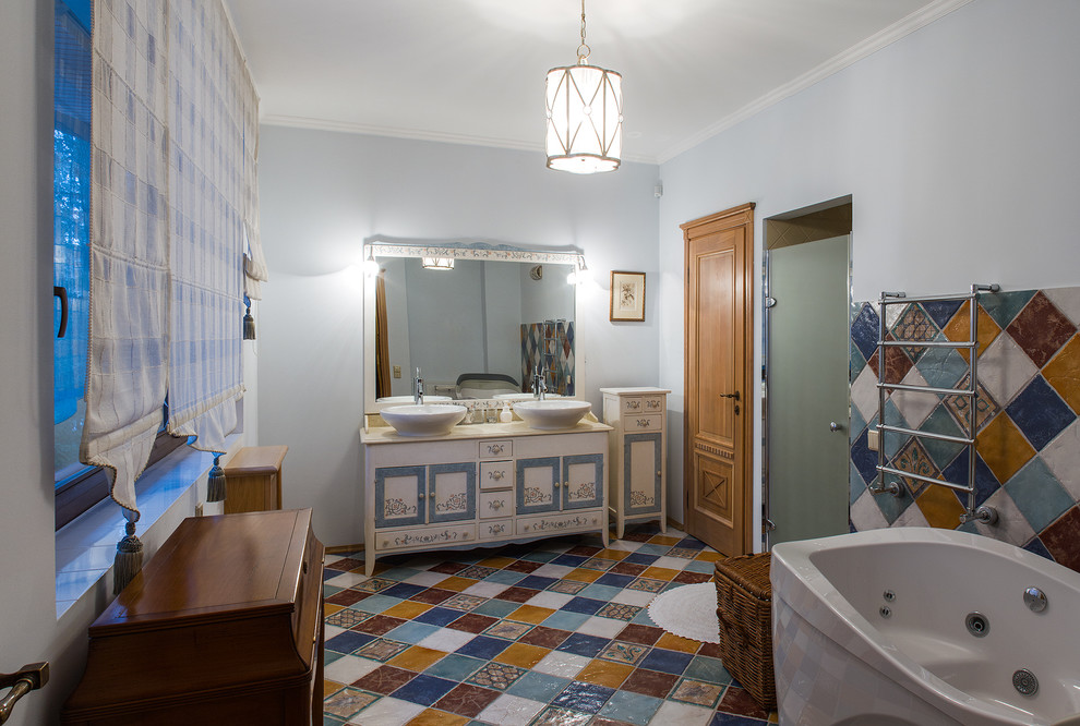 Design ideas for a medium sized traditional bathroom in Moscow with freestanding cabinets, white cabinets, marble worktops, multi-coloured tiles, ceramic tiles, a freestanding bath, a two-piece toilet, a console sink, blue walls and ceramic flooring.