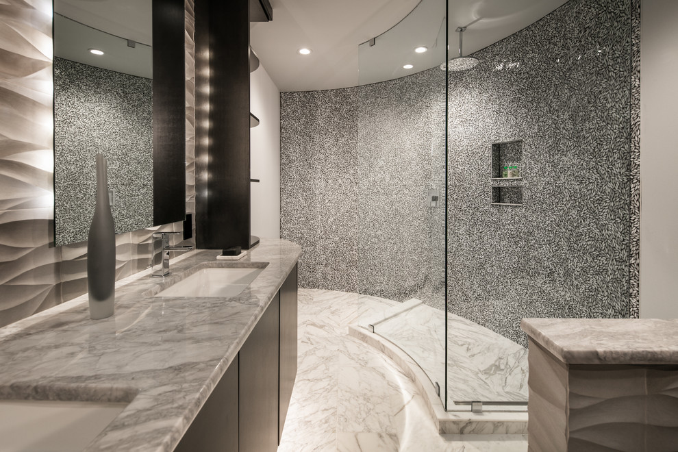 This is an example of a large modern ensuite bathroom in San Diego with flat-panel cabinets, black cabinets, a corner shower, black and white tiles, mosaic tiles, white walls, a submerged sink, marble worktops and marble flooring.
