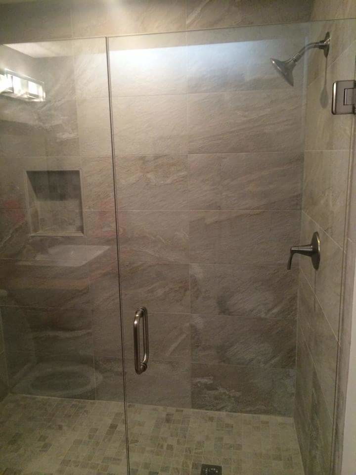 Medium sized urban bathroom in Cincinnati with a built-in sink, flat-panel cabinets, medium wood cabinets, wooden worktops, an alcove shower, a two-piece toilet, grey tiles, porcelain tiles, grey walls and concrete flooring.