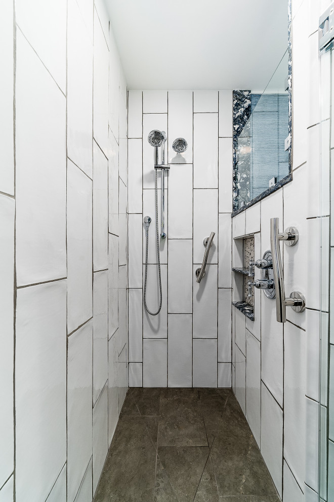 Corner shower - large traditional master yellow tile brown floor corner shower idea in Columbus with flat-panel cabinets, white cabinets, blue walls, quartzite countertops and blue countertops