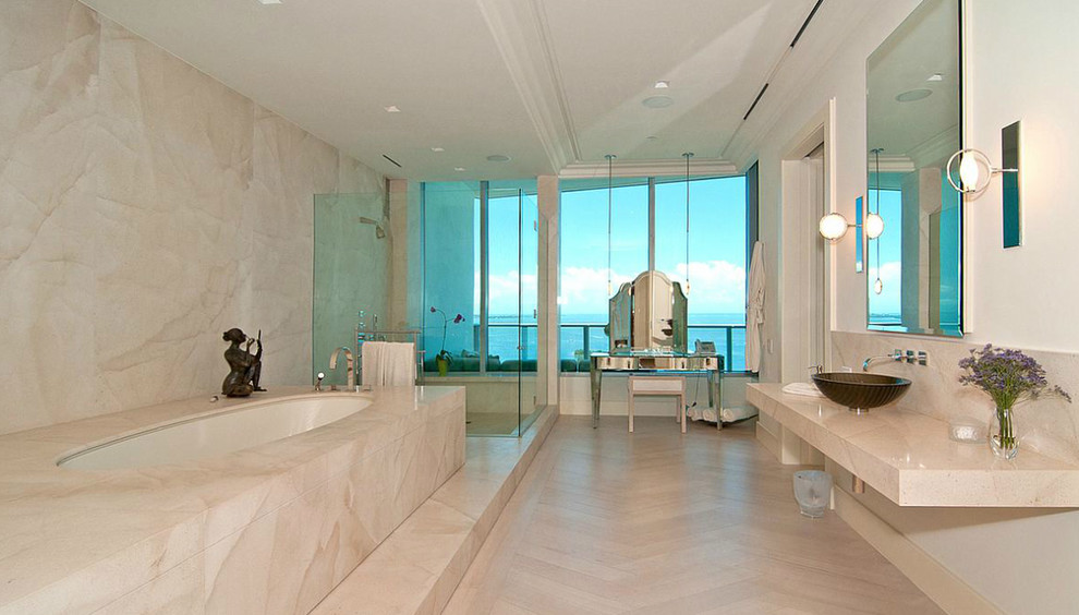 Example of a large trendy master beige tile and stone tile doorless shower design in Miami with marble countertops, an undermount tub and white walls
